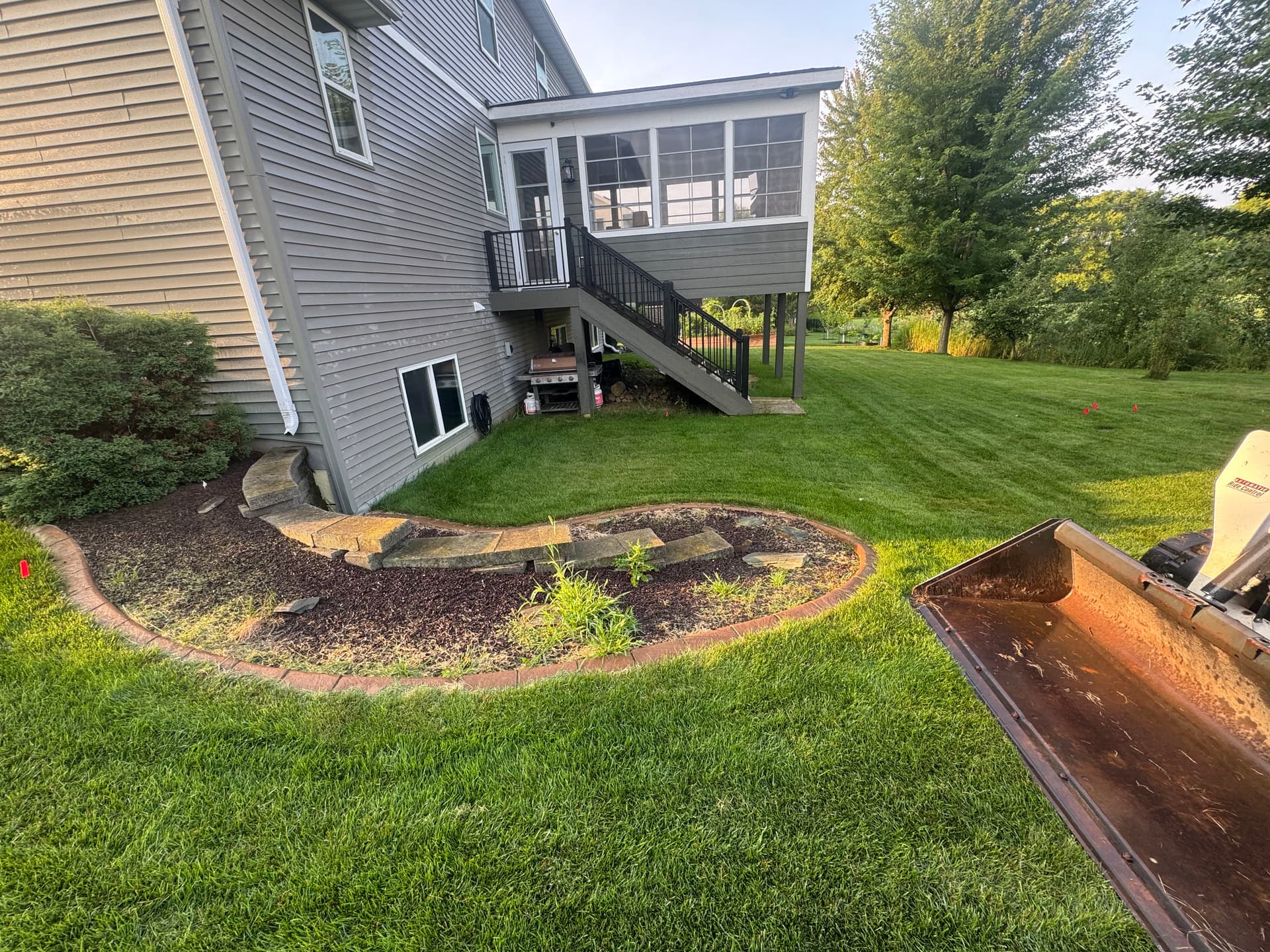 Backyard Transformation with Retaining Wall and Outdoor Kitchen in Lakeville
